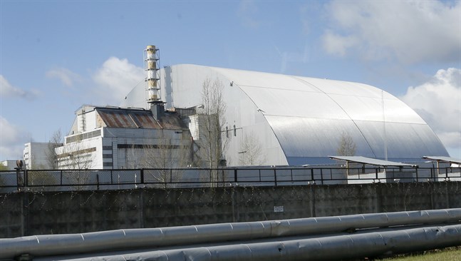 Sarkofagen över reaktor 4 i Tjernobyl. Arkivbild.