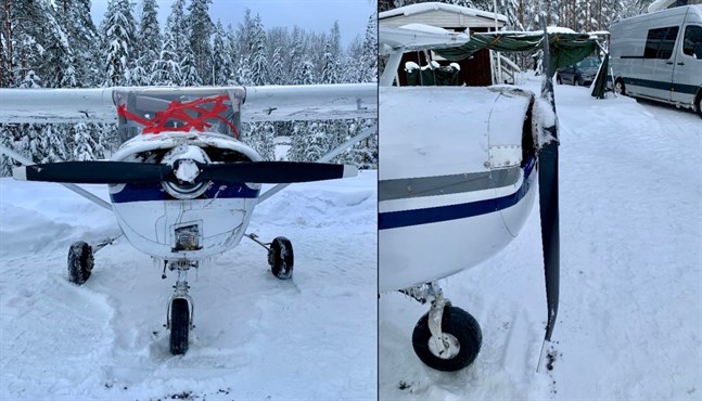 Planet hamnade på taket i snön. Här ses det efter olyckan med tejpad vindruta och skadad propeller.