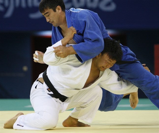 Naidangiin Tüvshinbayar, Mongoliet (i vitt) när han tog OS-guld i Peking 2008.